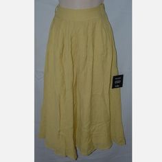 This Skirt Is Size Xs And Made By Lulus. It Is New With Tags, Might Have Some Wrinkling With Shipping. It Is Made With 75% Rayon And 25% Polyester And Hand Washable. It Is Fully Lined And Have A Hidden Zipper On The Side Of The Waist. The Waist Measures About 12" Across And It Is 31" In Length. Very Nice Skirt. Yellow Skirt With Elastic Waistband For Day Out, Yellow Long Skirt For Summer, Yellow Relaxed Skirt Bottoms With Elastic Waistband, Casual Mustard Skirt, Yellow Skirt With Elastic Waistband, Casual Yellow Wide Leg Skirt, Casual Wide Leg Yellow Skirt, Yellow Skirted Bottoms With Elastic Waistband, Yellow Skirted Bottoms For Summer