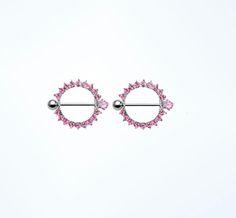 pink crystal stud earrings on white background