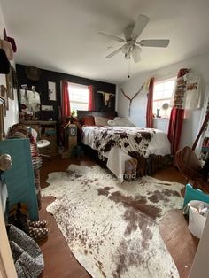 a bedroom with a cow hide rug on the floor