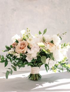 a bouquet of flowers sitting on top of a table