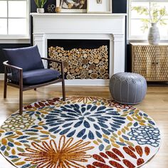 a living room filled with furniture and a fire place in front of a white fireplace