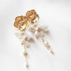 Floral Bridal Earrings, Gold Bridal Jewelry, Pearl Earrings for Bride, Long Wedding Earrings, Gold Flower Earrings Stud Earrings for Wedding - Etsy Elegant Rose Gold Flower Clip-on Earrings, White Pearl Drop Clip-on Earrings For Wedding, Gold Flower Chandelier Earrings Elegant Style, Gold Flower-shaped Elegant Chandelier Earrings, Gold Dangle Earrings With Flower Decoration, Elegant Gold Flower Chandelier Earrings, Elegant Rose Gold Flower-shaped Pearl Earrings, Delicate Flower Pearl Drop Earrings, Rose Gold Flower-shaped Earrings With Pearl Drop