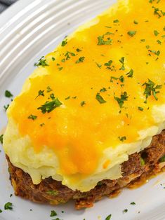 an omelet is sitting on a plate with parsley sprinkled on top