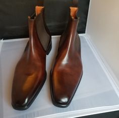 Brown Leather Ankle Boots Made By Renowned Italian Shoemaker, Santoni. An Elegant Chelsea Style Enhanced With A Rich Hand-Finished Nuanced Effect. Antiqued Leather, Beatles-Style. Smooth Uppers. Tonal Elasticated Ankle Inserts. Goodyear Welt Construction. Made In Italy. Size 10 (11 Us) Brand New But No Box. Designer Brown Boots For Formal Occasions, Designer Formal Boots With Rubber Sole, Designer Plain Toe Boots For Formal Occasions, Semi-formal Wingtip Boots With Leather Lining, Brown Leather-lined Chelsea Ankle Boots, Luxury Men's Chelsea Boots For Semi-formal Occasions, Beatles Fashion, Luxury Leather-lined Men's Ankle Boots, Brown Suede-lined Chelsea Ankle Boots