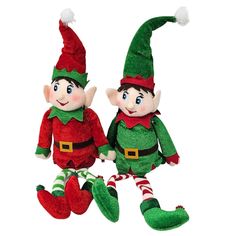 two christmas elf dolls sitting next to each other