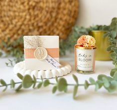 a candle and some flowers on a table