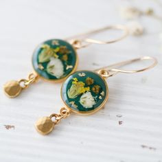 What stunning earrings by @rebeccanoeldesigns! Pressed Flower Drop Earrings, Botanical Pressed Flowers Dangle Earrings, Nature-inspired Round Pressed Flowers Earrings, Nature-inspired Green Earrings With Pressed Flowers, Unique Flower-shaped Resin Earrings, Round Of Applause, Dried And Pressed Flowers, Stunning Earrings, Gorgeous Jewelry