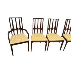 four chairs with yellow patterned upholstered seats