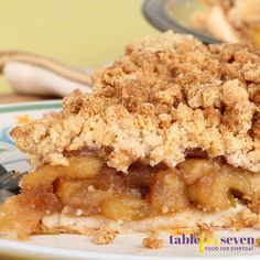 a close up of a slice of pie on a plate with a fork in it