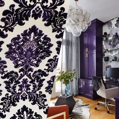 a living room with purple and white decor on the walls, an area rug in front of a window