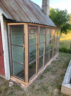 an old greenhouse is being used as a planter