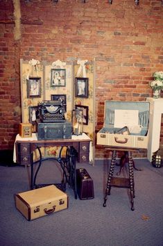 an old fashioned sewing machine sitting on top of a table next to other antique items