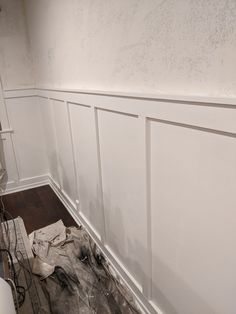 a room that is being remodeled with white paint