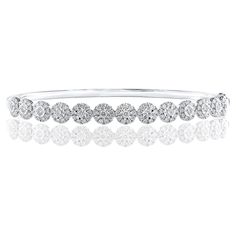 A fashionable bangle showcasing 130 brilliant cut diamonds weighing 1.47 carats total. Set in a polished 18K White Gold mounting. Style is available in different price ranges. Prices are based on your selection. Don't hesitate to get in touch with us for more information. Bracelet Tennis, Diamond Bangle, Tennis Bracelet, Brilliant Cut Diamond, Diamond Cuts, Jewelry Bracelets, Bangles, White Gold, Bracelet