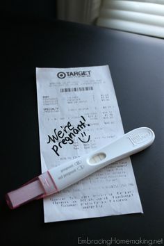 a receipt sitting on top of a table next to a toothbrush and a pen