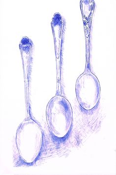 three spoons are lined up next to each other