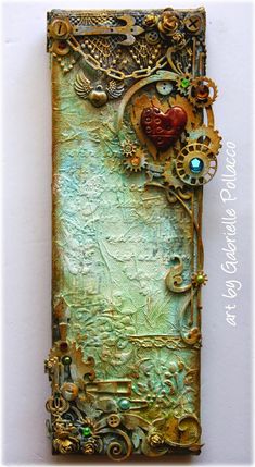 an altered book with gears and other things on it