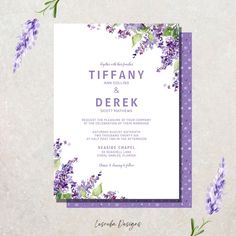 a wedding card with purple flowers on it