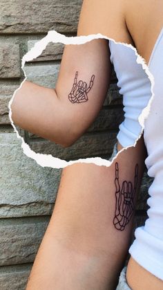 two people with tattoos on their arms, one has a peace sign and the other has a hand