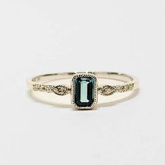 A gorgeous pop of deep London blue topaz, accented with diamonds on a dainty, 14k white gold beaded stacking ring. Wear it alone, or stack it with others - there's no one way to wear these beauties! Size 7 *can be resized for an additional fee .22 ct London blue topaz and .04 ct tw diamond Beaded Stacking Rings, Diamond Stacking Rings, London Blue Topaz, London Blue, Stacking Ring, Stacking Rings, Gold Beads, Blue Topaz, Sapphire Ring