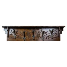 a metal shelf with hooks and flowers on it