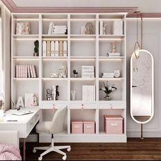 a white desk and chair in front of a bookshelf with many shelves on it