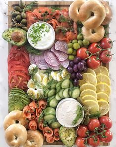 an array of fruits and vegetables arranged in the shape of a rainbow