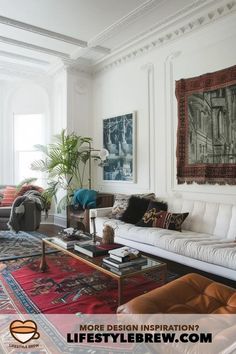 a living room with couches, rugs and pictures on the wall above them