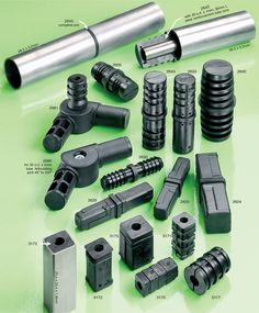 an assortment of different types and sizes of metal parts on a green surface with words describing them