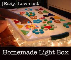 an easy low - cost light box for toddlers to play with in the dark