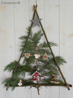 a christmas tree made out of branches and ornaments