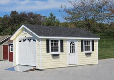 two garages with windows and doors on each side