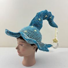 a crocheted blue hat with stars on it