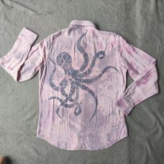 a pink shirt with an octopus on it