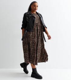 New Look Curves Brown Leopard Print Smock Midi Dress. Curves. Designed in a classic leopard print, this brown midi dress will see you through the seasons in style. Pair it with sandals on sunny days and biker boots when the temps drop. Online exclusive. Leopard print. Crew neckline. Short sleeves. Midi length. Soft crepe fabric. Oversized fit. Model is 5'9.5"/176cm and wears UK 18/EU 46/US 14. Leopard Print Dress Outfit, Biker Boots Outfit, Printed Dress Outfit, Brown Midi Dress, Leopard Print Boots, Brown Pattern, Brown Leopard, Leopard Print Dress, Biker Boots