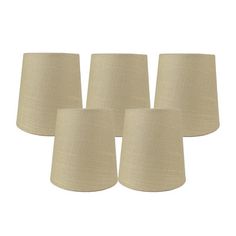 four beige linen lampshades on a white background