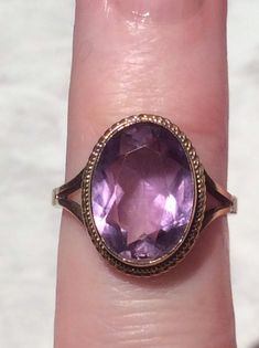 Stunning Vintage 9ct gold sparkly amethyst ring.Here we have a lovely large amethyst ring set in 9ct gold.The faceted amethyst a fabulous rich light purple and dark purple in certain lights with the many faceted amethyst stone. The sparkly amethyst is simply set in a fine gold setting and has a fine gold rope border, with simple openwork gold shoulders, which complement the ring.The ring is in a good Vintage condition.  The Almandine garnet is firmly set in a gold roll over setting, and has no c Almandine Garnet, Amethyst Gold, Amethyst Gem, Purple Band, Gold Set, Light Purple, Amethyst Stone, Sapphire Diamond, Amethyst Ring