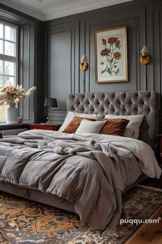 a large bed sitting next to a window in a bedroom on top of a rug