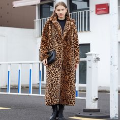 Make a bold fashion statement with this Leopard Print Faux Fur Long Coat. Crafted for those who want to stand out, this coat features a striking leopard print pattern and a luxurious faux fur exterior. With its long length, it's the ideal choice for adding a touch of glamour and wild sophistication to your outfit. Step into the spotlight with this trendy faux fur coat that commands attention and exudes confidence. Celana Jins, Macan Tutul, Faux Fox Fur Coat, Celana Kargo, Fur Trench Coat, Long Suit, Long Fur Coat, Long Faux Fur Coat, Plush Coat