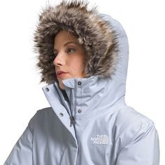 When falling leaves switch to snowy flurries, zip into The North Face's Arctic Bomber Jacket. This insulated layer provides the warmth we need as the seasons switch, and it features waterproof tech for added protection when snowstorms take us by surprise. Ribbed details give this jacket pilot-inspired flair, and a faux-fur ruff on the hood holds warmth close to the face while we explore. Outerwear With Detachable Hood For Ski Season, Insulated Parka For Winter Sports, Hooded Outerwear For Snow And Ski Season, The North Face Weatherproof Winter Outerwear, The North Face Parka For Outdoor Fall Use, The North Face Weatherproof Outerwear For Cold Weather, Weatherproof Skiing Outerwear For Fall, The North Face Winter Outerwear With Double-lined Hood, Functional Windproof Outerwear For Snow