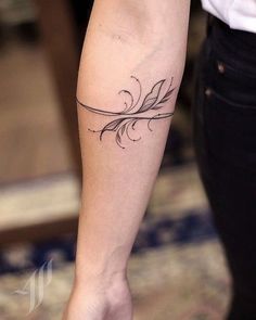 a woman with a tattoo on her arm