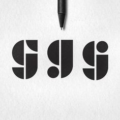 a pen is sitting on top of a piece of paper with the word gu written in it