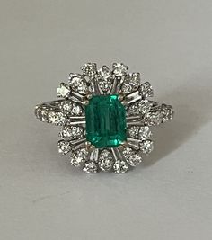 White gold (18k) ring centered on a rectangular Colombian emerald with cut sides of 1.52 ct (7.75 x 5.94 x 4.52 mm) surrounded and supported by brilliant-cut and baguette-cut diamonds. Total weight of diamonds: approximately 1.00 ct. GIA certificate for emerald. Tray: 20 x 15 mm. Gross Weight: 4.56 g. Size: 54 Possibility of sizing, contact us. Further information : We issue an invoice as well as a certificate of authenticity established by our qualified gemologist (LFG Paris). Our photos are no Formal Rectangular Emerald Diamond Ring, Rectangular Emerald Diamond Ring For Formal Occasions, Formal Rectangular Emerald Ring With Center Stone, Formal Rectangular Emerald Ring With Prong Setting, Elegant Rectangular Emerald Ring Gia Certified, Elegant Rectangular Gia Certified Emerald Ring, Gia Certified Rectangular Emerald Ring, Elegant Gia Certified Rectangular Emerald Ring, Rectangular Emerald Ring With Brilliant Cut Diamond