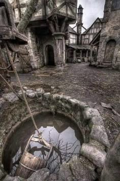 an old abandoned house with a water hole in the ground