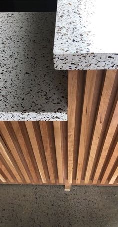 the counter top is made out of wood and has white speckles on it