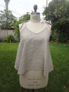 "This camisole is made from 100% Medium Weight linen.Natural linen cami top with spaghetti straps and v-cut neckline. Your best choice for hot summer days! Functional Strappy tank helps you move with style, comfort and flexibility. Linen  fabric drapes beautifully for a comfortable, flattering fit Easy to incorporate with both casual and dressy looks for a variety of styling options. Pair with a relax pant and flat form sandals for a picnic in the park, or add to skinny jeans, booties and a card Flat Form Sandals, Linen Cami, At The Movies, Relax Pants, West Covina, Picnic In The Park, Draped Fabric, V Cut, V Cuts