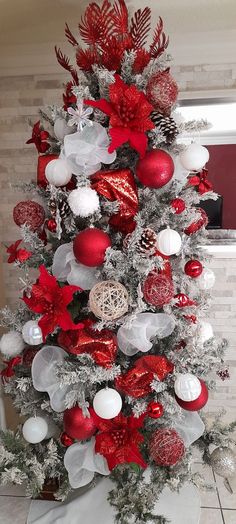 a christmas tree decorated with red and white ornaments