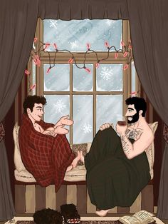 two men sitting on a couch in front of a window with snowflakes hanging from the windowsill