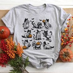 Retro Cat Halloween Shirt, 90s Cat Witch Vintage Sweatshirt, Halloween Cat Lovers Gift, Funny Witch Cat Tee, Unisex Tee Cat Lover Gift Women  🎉Indulge in nostalgia with our Retro Cat Halloween Shirt, featuring a 90s Cat Witch Vintage design on a cozy sweatshirt. This unique piece is the perfect Halloween gift for cat lovers, combining humor and charm with its witchy feline theme. The unisex tee is tailored for all cat enthusiasts, making it an excellent gift choice for women who cherish their furry friends. Embrace the festive spirit with this amusing Witch Cat Tee, a delightful addition to any cat lover's wardrobe. 🎉 Highlighted features: - Versatile and fits all body shapes. - High-quality cotton fabric for comfort. - No excess threads on the product. 🎉 Care instructions: - Wash insid Halloween Cat Print Crew Neck T-shirt, Casual Gray Tops For Halloween, Novelty Halloween Tops With Cartoon Print, Novelty Cartoon Print Tops For Halloween, Halloween Cat Print Crew Neck Top, Spooky Fall Tops With Cat Print, Spooky Cat Print Tops For Fall, Gray Crew Neck Top For Halloween, Witch Vintage