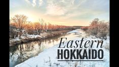 the words eastern hokkado are in front of a river and snowy landscape with trees